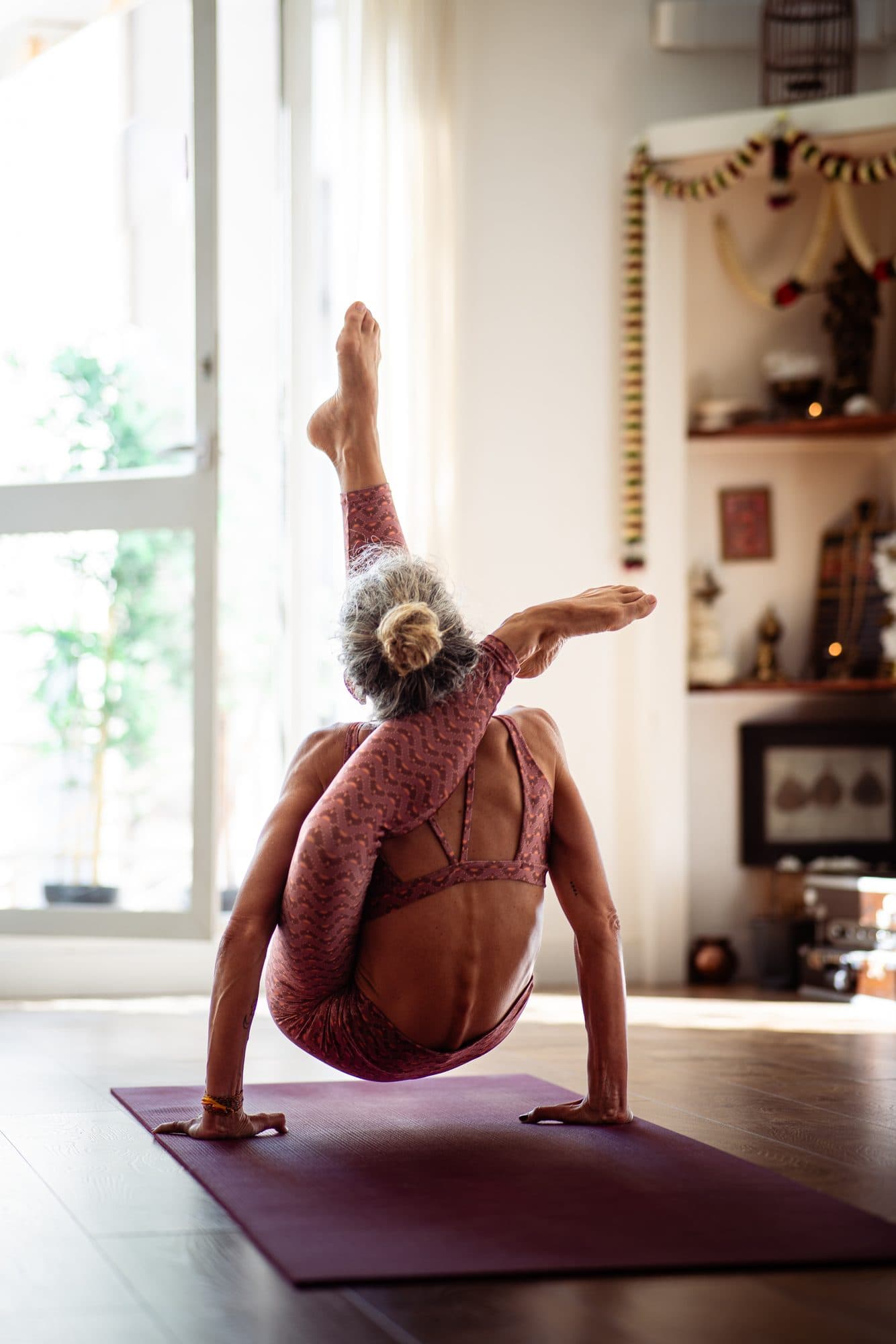Lotta in a seated spinal twist